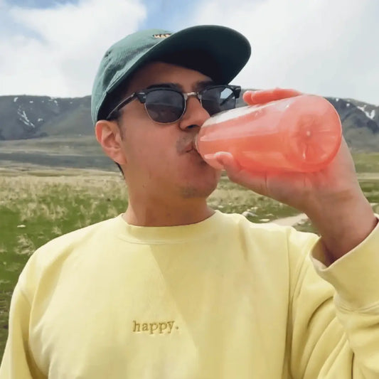 happy guy drinking a hydrant